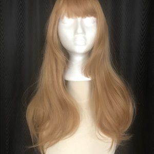 New never worn. Beautiful 24 in dark blond sexy long synthetic wig.